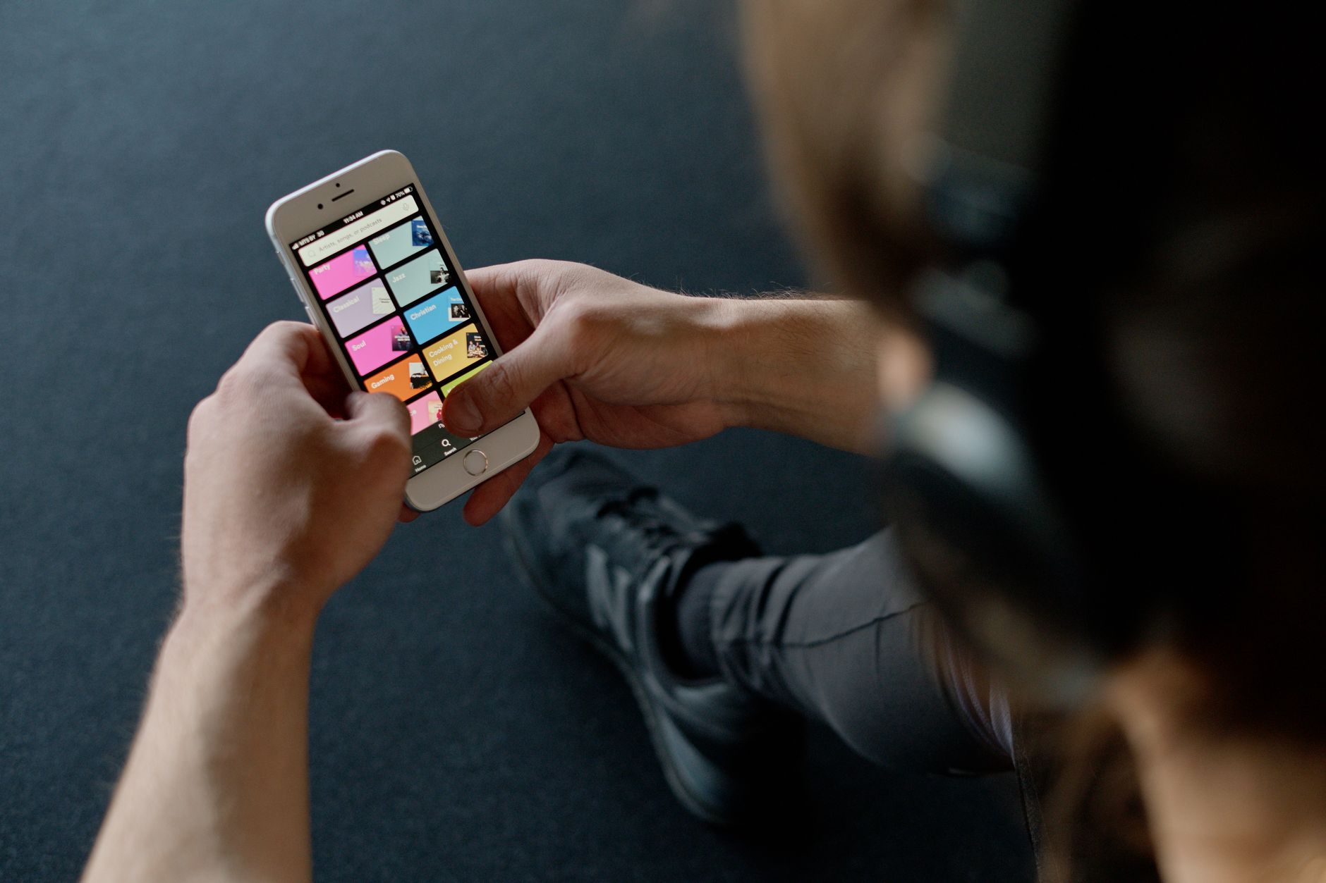 Athlete checking a fitness app on a phone for Why a useful free training plan still needs honest AI credit limits.