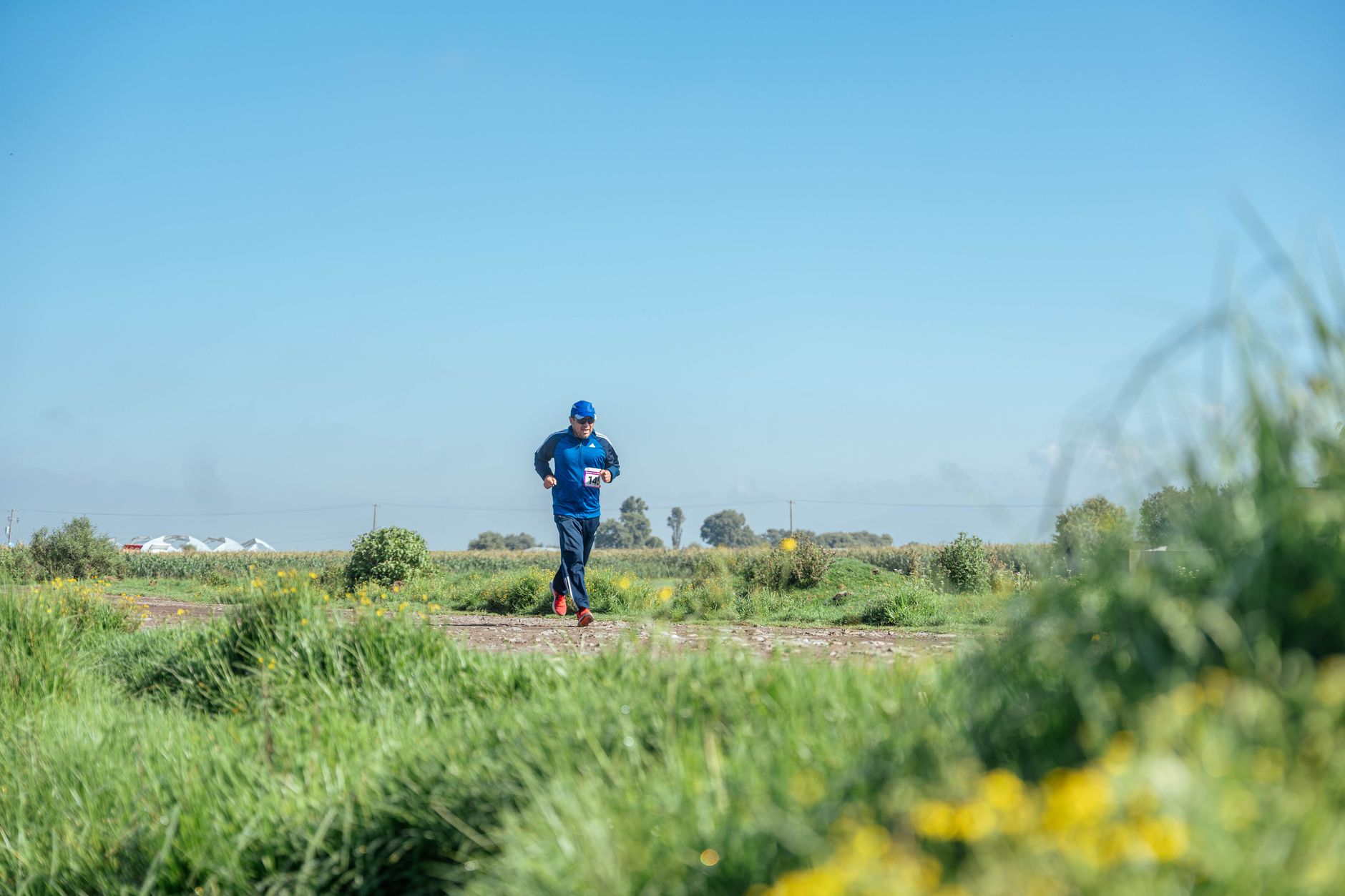 Runner training outdoors for Best strength and running app for hybrid athletes.