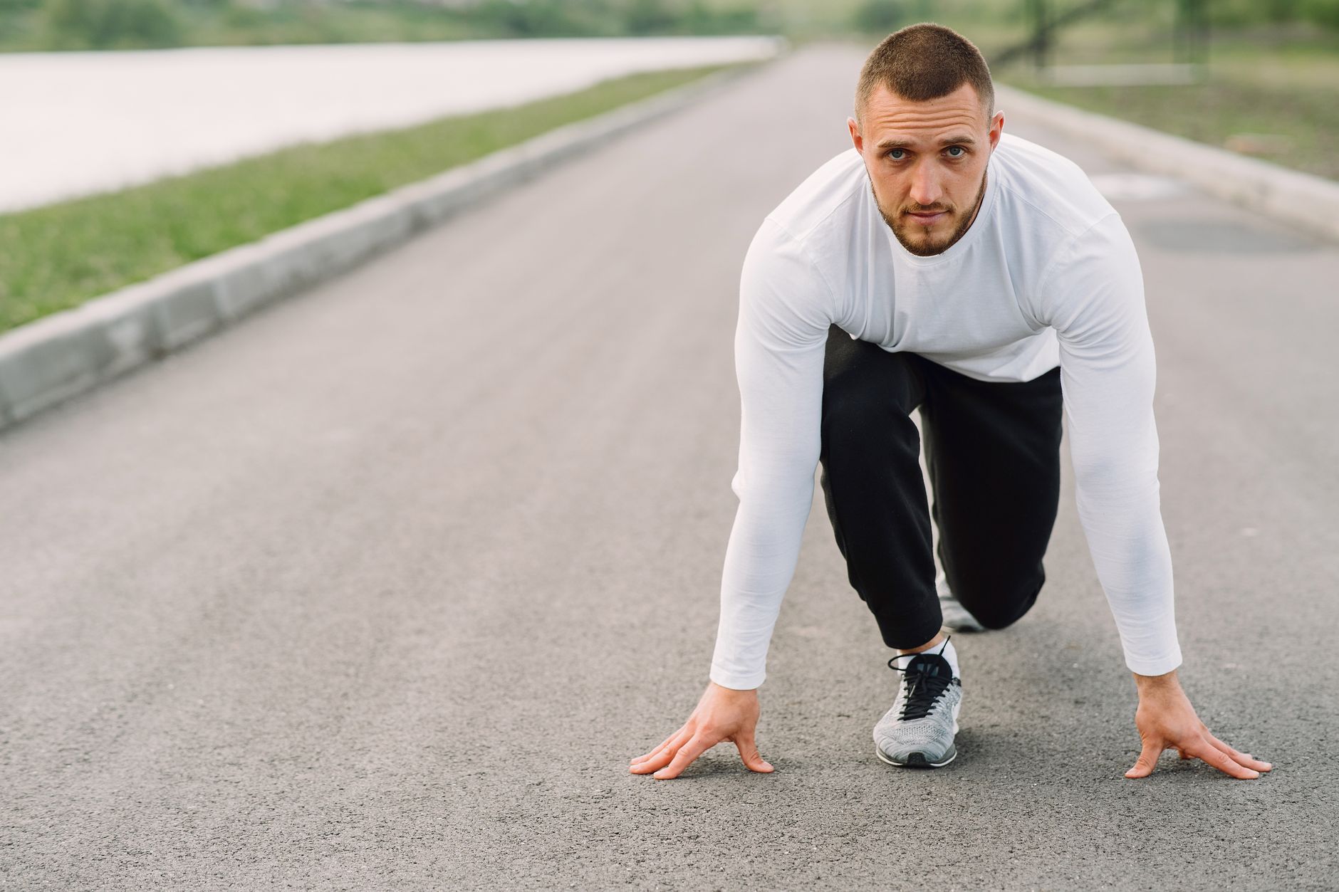 Runner training outdoors for Best gym tracking app for runners who lift.