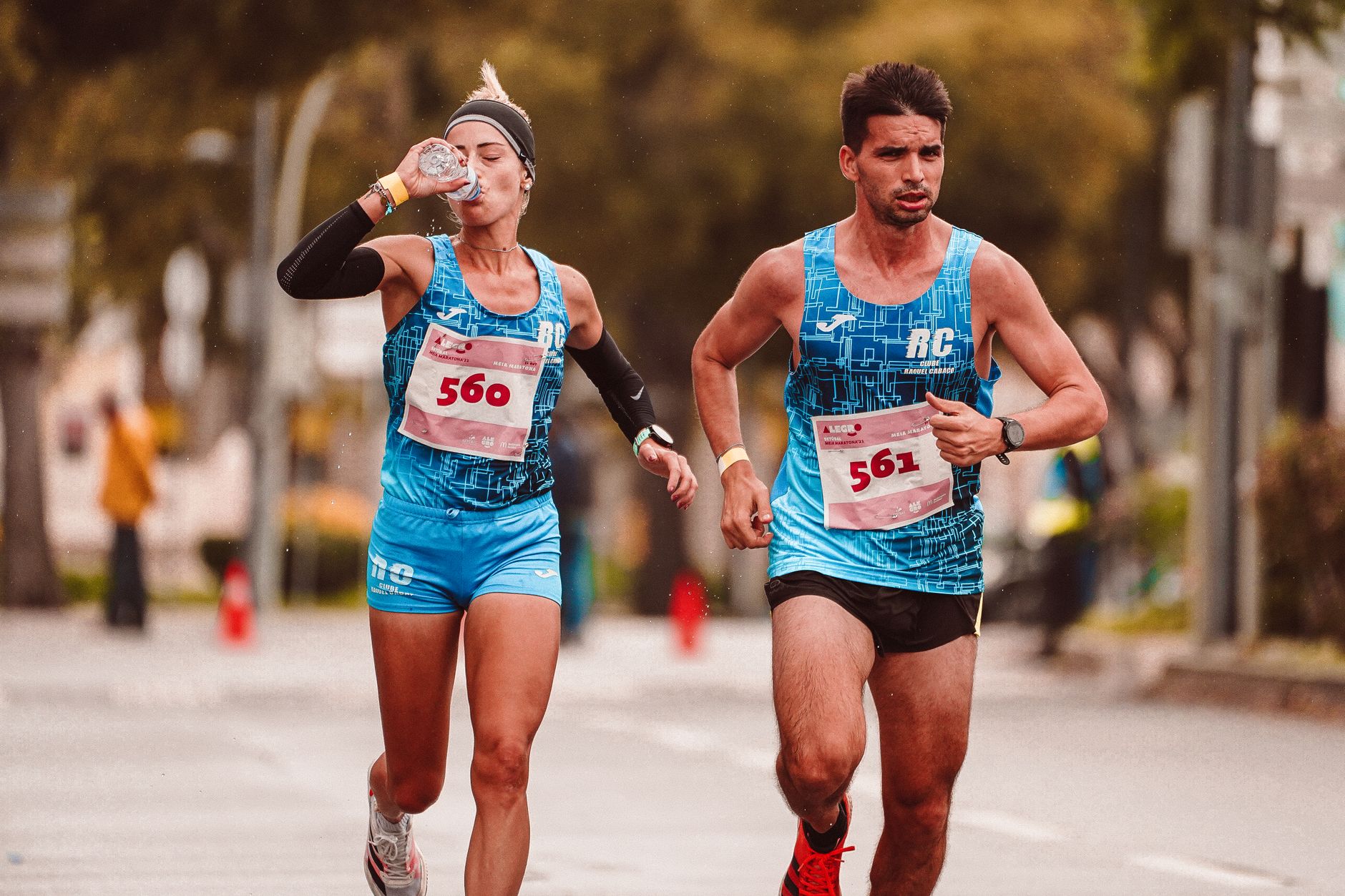 Two runners training outdoors for route context and load management.